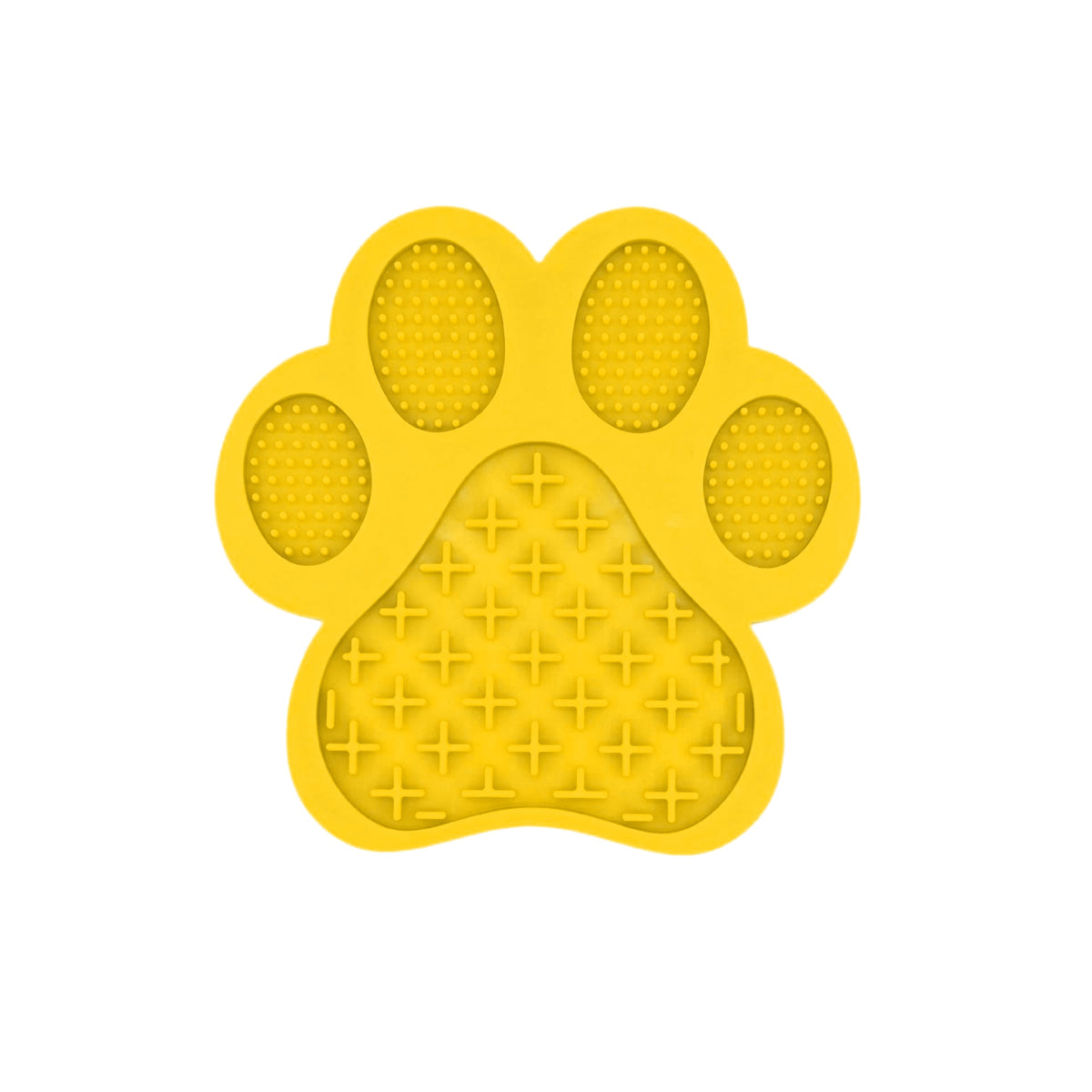 Puppy licking a paw-shaped lick mat at home